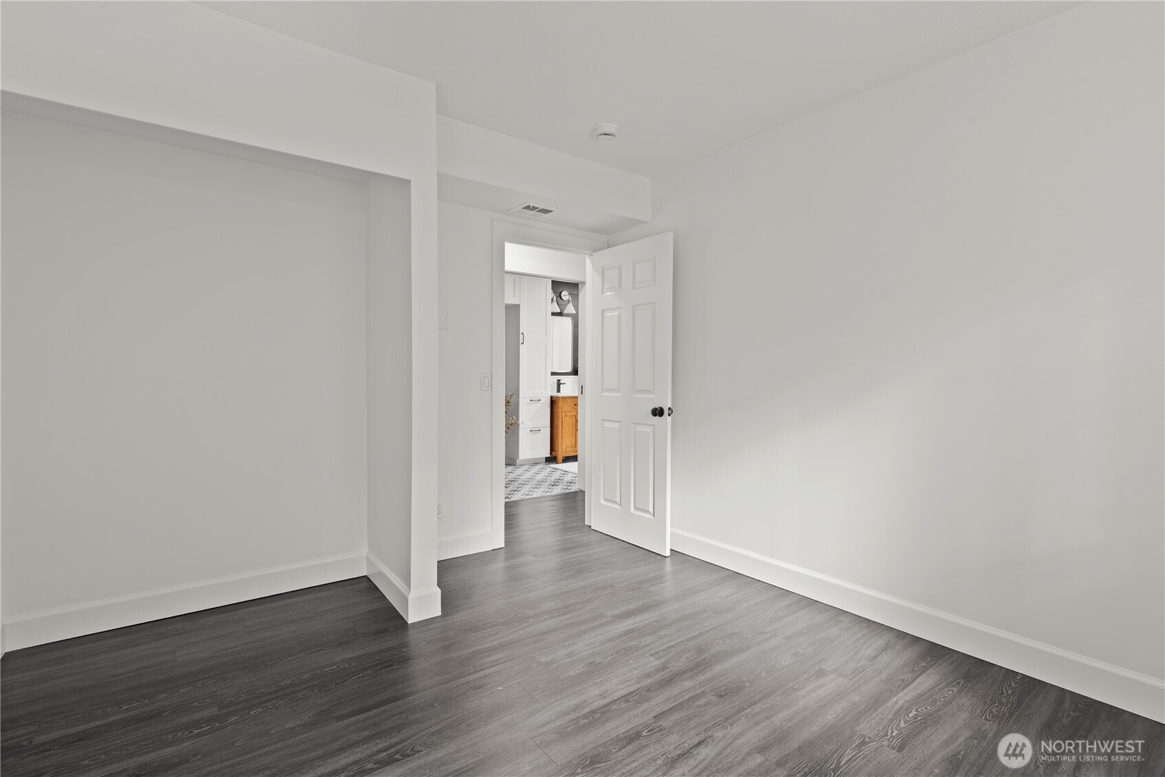 8732 209th Place Southwest Edmonds, WA 98026 - Photo 25 of 39 a view of an empty room and wooden floor
