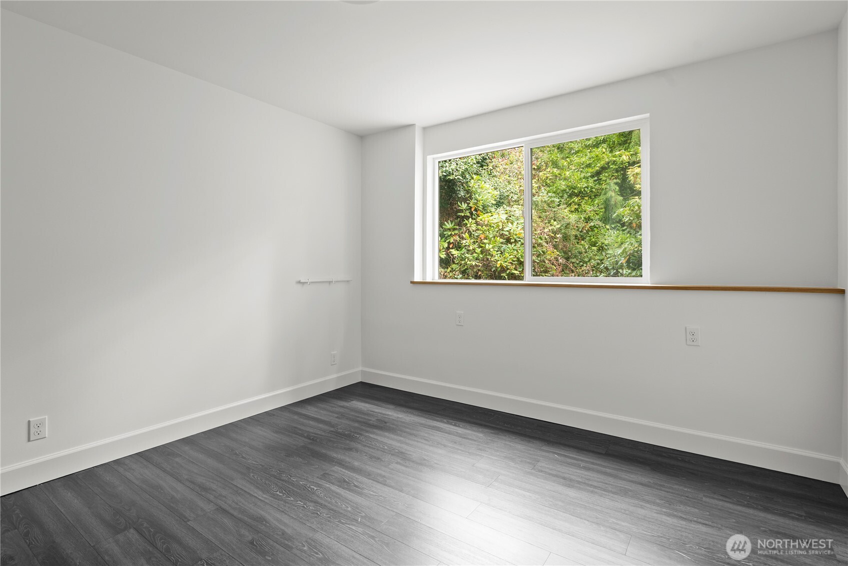 8732 209th Place Southwest Edmonds, WA 98026 - Photo 26 of 39 an empty room with wooden floor and window