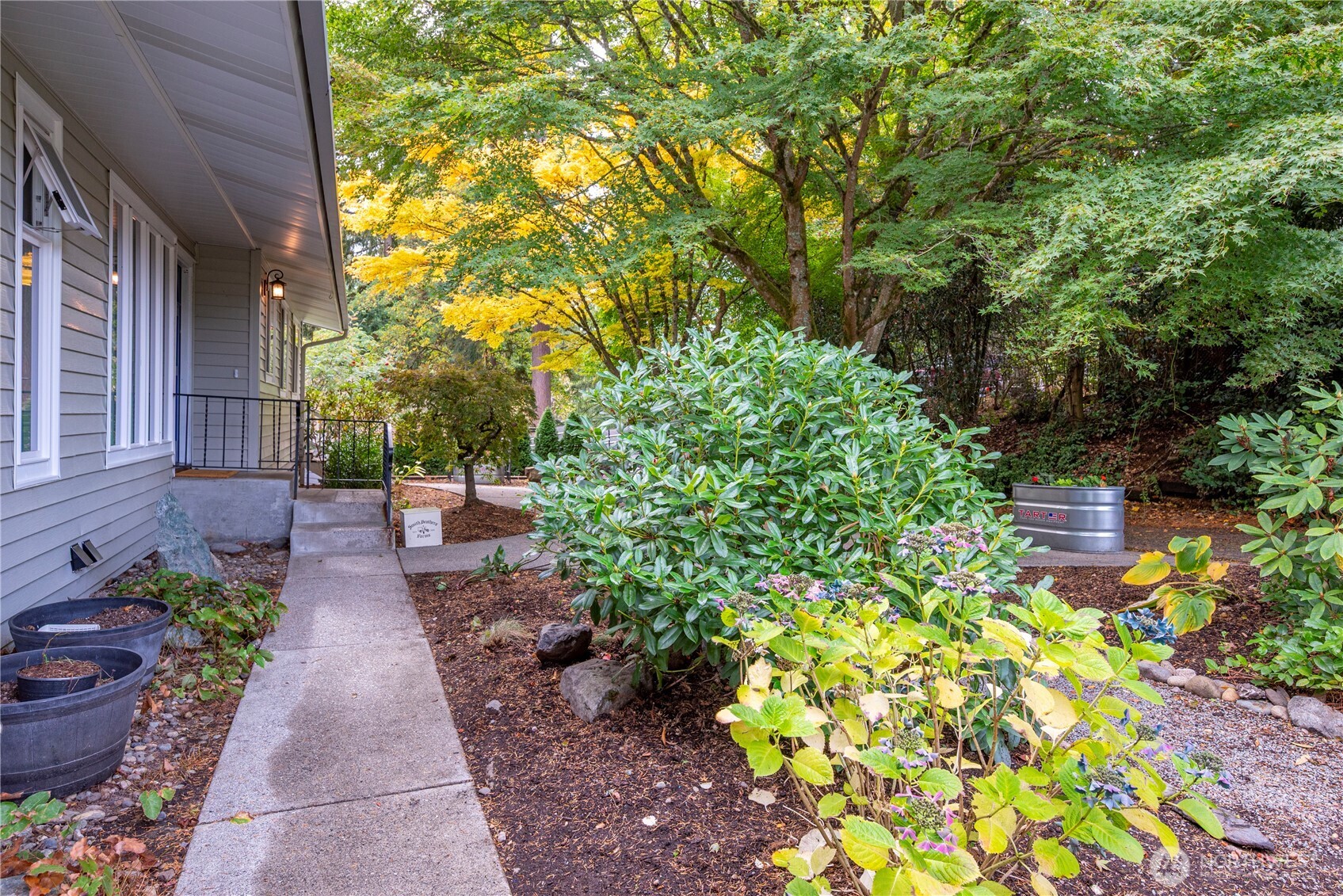 8732 209th Place Southwest Edmonds, WA 98026 - Photo 35 of 39 a view of a pathway with flower plants