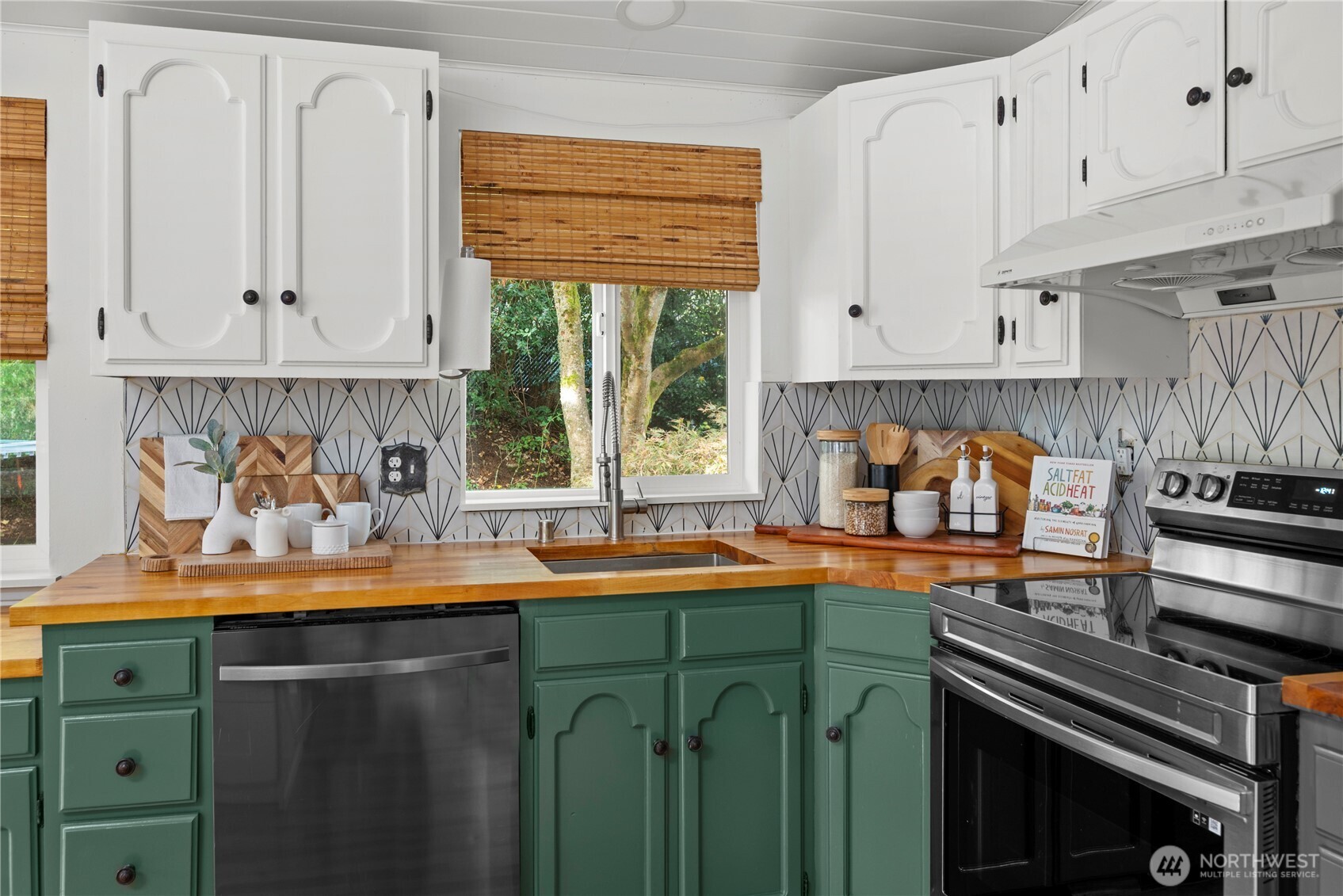 8732 209th Place Southwest Edmonds, WA 98026 - Photo 5 of 39 a kitchen with stainless steel appliances kitchen island granite countertop a sink a stove and cabinets