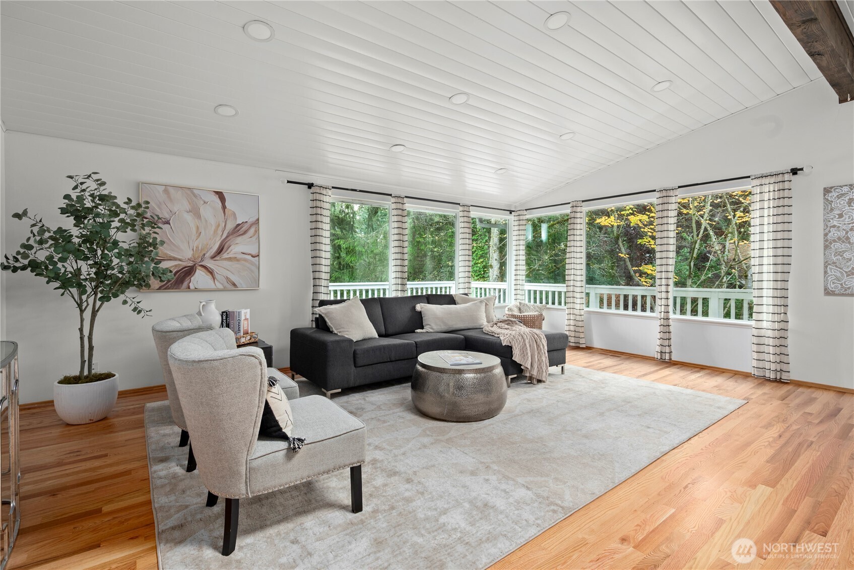 8732 209th Place Southwest Edmonds, WA 98026 - Photo 8 of 39 a living room with furniture and a large window