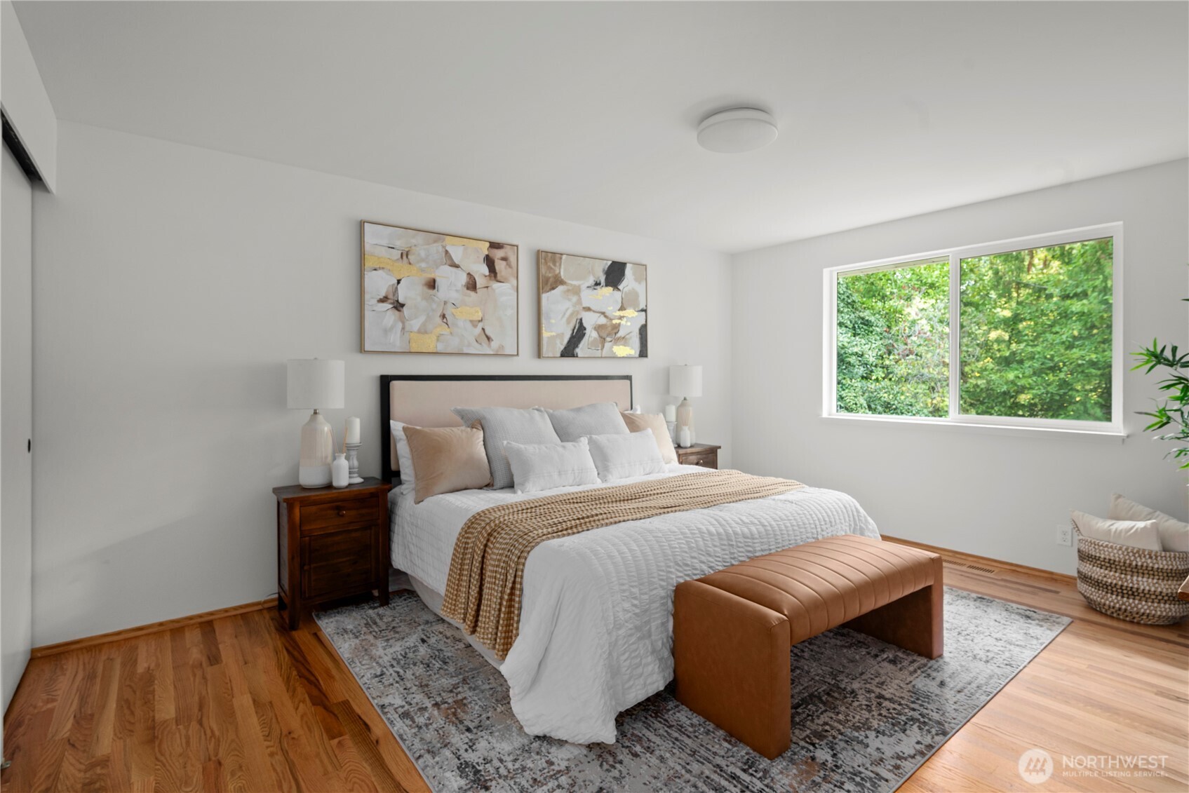 8732 209th Place Southwest Edmonds, WA 98026 - Photo 10 of 39 a bedroom with a bed and wooden floor