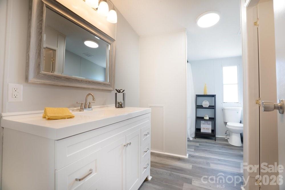 889 Tabor Road Olin, NC 28660 - Photo 15 of 34 a bathroom with a sink and a mirror