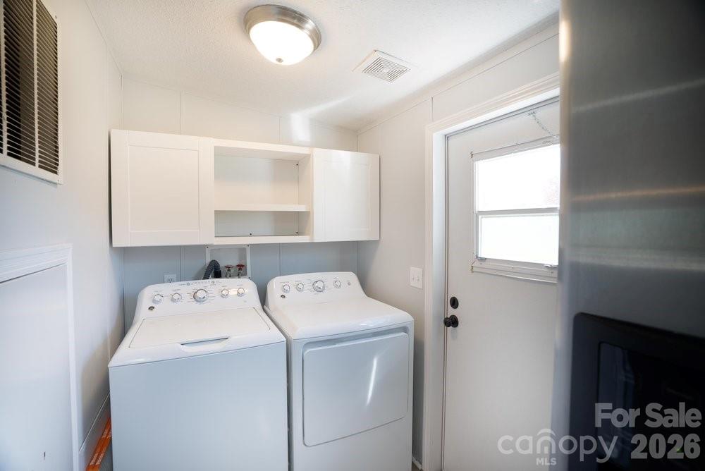 889 Tabor Road Olin, NC 28660 - Photo 21 of 34 a utility room with dryer and washer