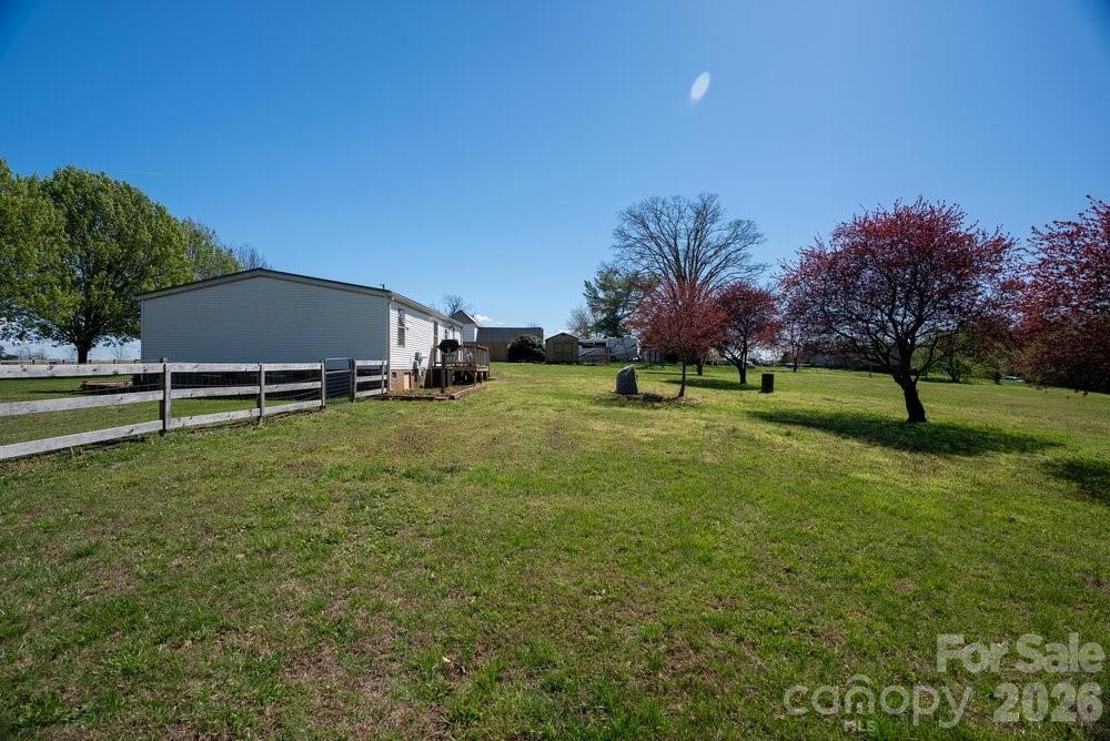889 Tabor Road Olin, NC 28660 - Photo 23 of 34 a view of a house with a yard