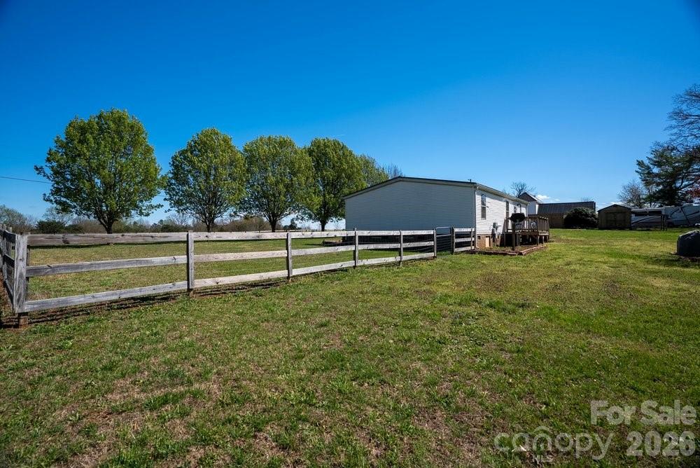 889 Tabor Road Olin, NC 28660 - Photo 3 of 34 a backyard of a house with lots of green space