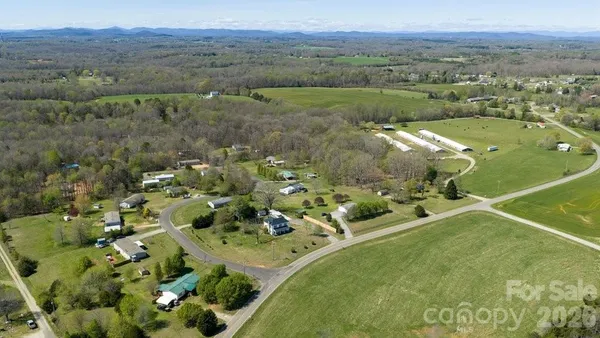 an aerial view of a golf course with parking space