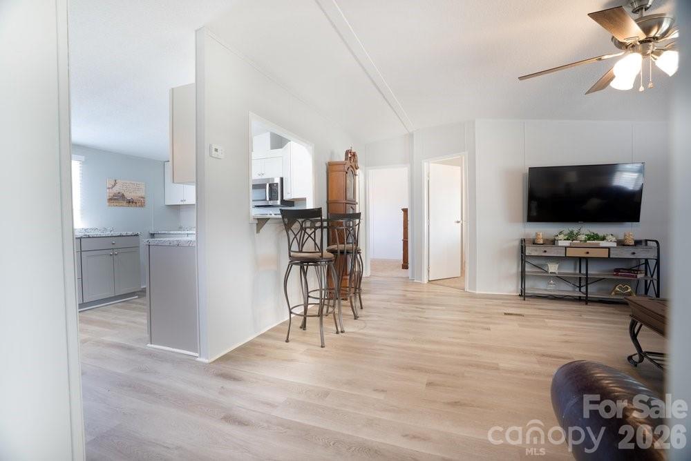 889 Tabor Road Olin, NC 28660 - Photo 5 of 34 a view of a livingroom with furniture and a flat screen tv