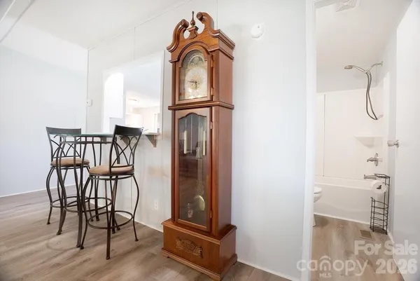a view of a livingroom with furniture and staircase