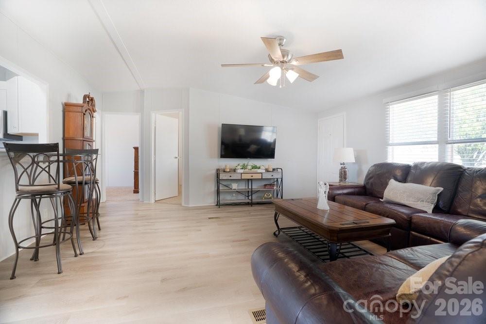 889 Tabor Road Olin, NC 28660 - Photo 8 of 34 a living room with furniture and a flat screen tv