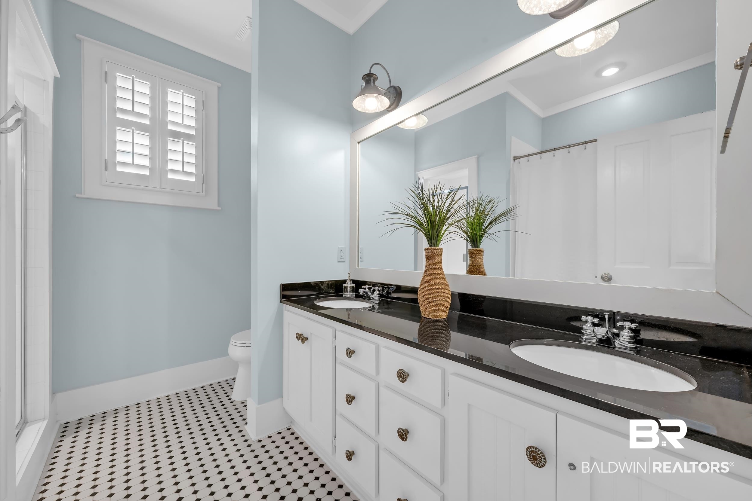25773 Canal Road, Unit 32 Orange Beach, AL 36561 - Photo 19 of 35 Full bath with a shower with shower curtain, double vanity, crown molding, and light tile patterned flooring
