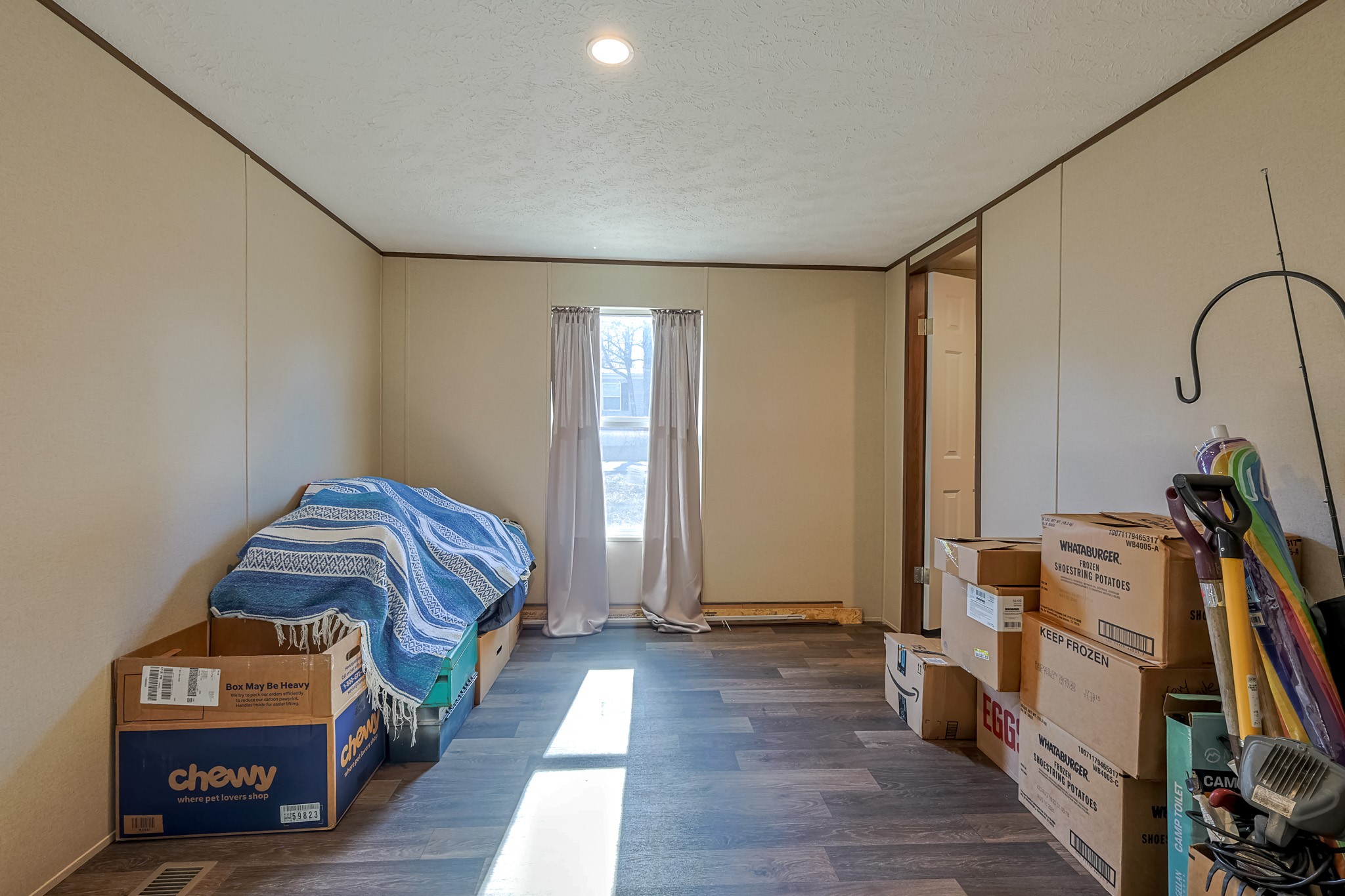 15 Great Oak Trinity, TX 75862 - Photo 14 of 26 a bedroom with furniture and a wooden floor