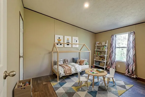 a bedroom with a bed and a chair