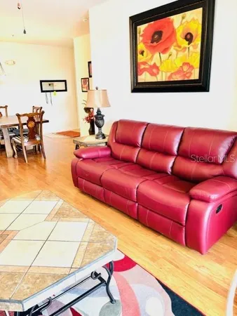 a kitchen with stainless steel appliances a refrigerator sink and white cabinets