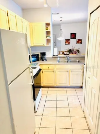 a kitchen with a stove and a refrigerator