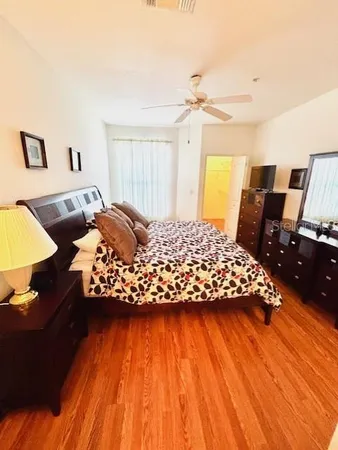 a bed room with a bed and a flat screen tv