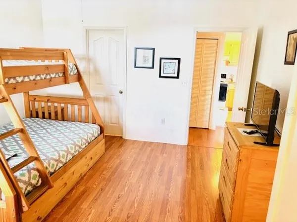 a view of a chairs in wooden floor in front of a house