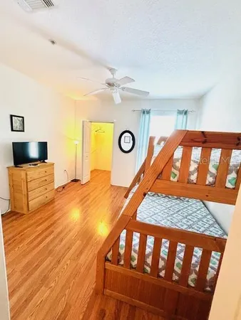 a living room with furniture and flat screen tv