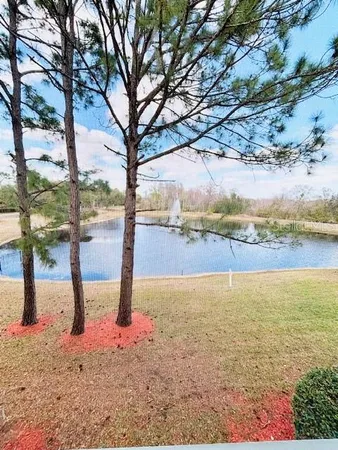 a view of a patio with a table and chairs
