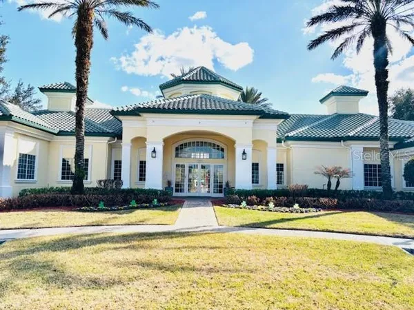 a view of a swimming pool with a yard