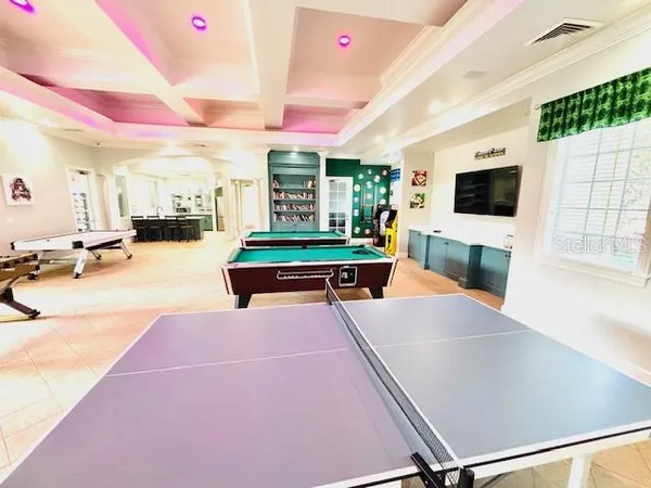 a view of a swimming pool with an outdoor seating