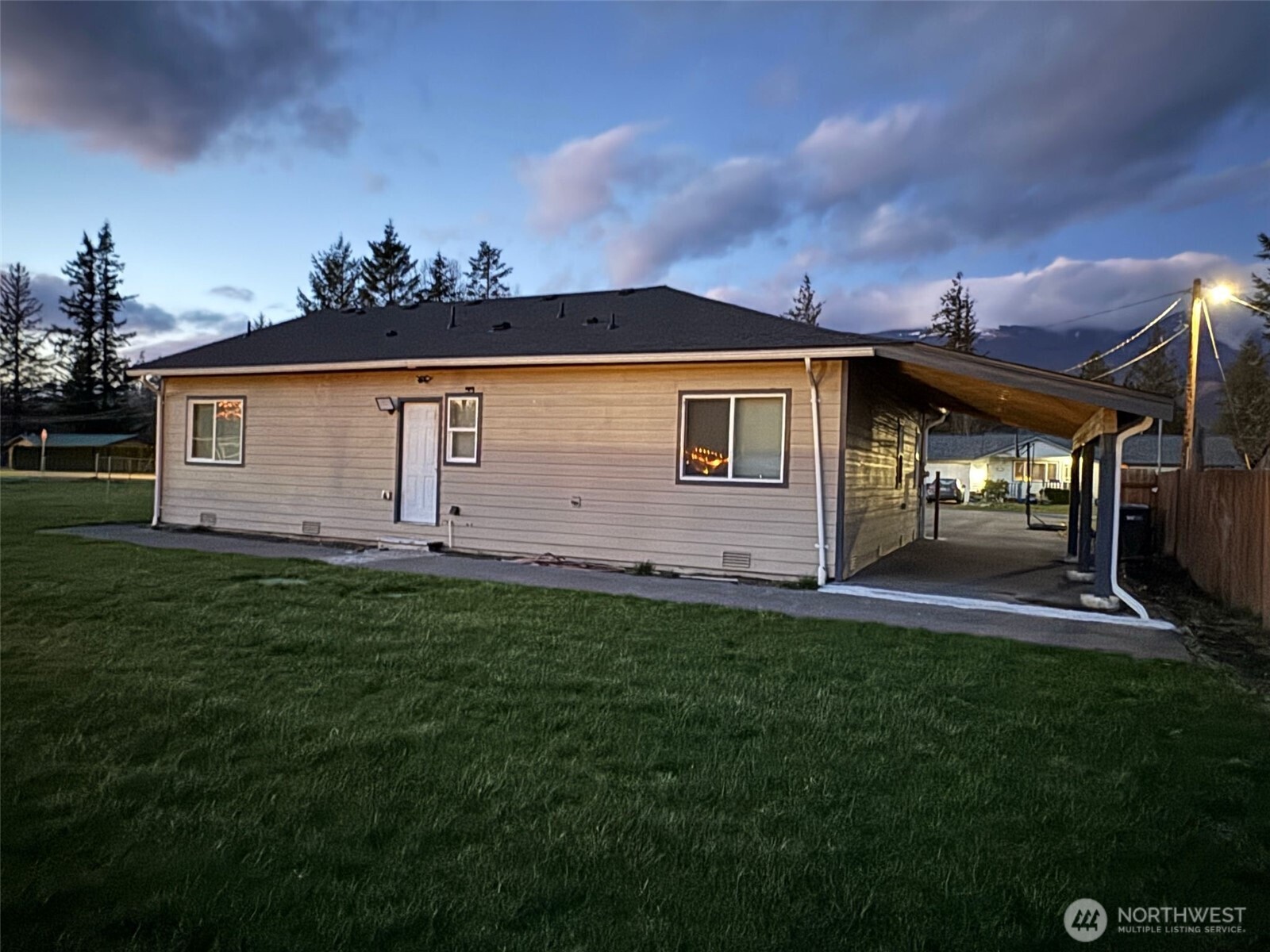 918 Orchard Avenue Gold Bar, WA 98251 - Photo 2 of 9 a front view of a house with a garden