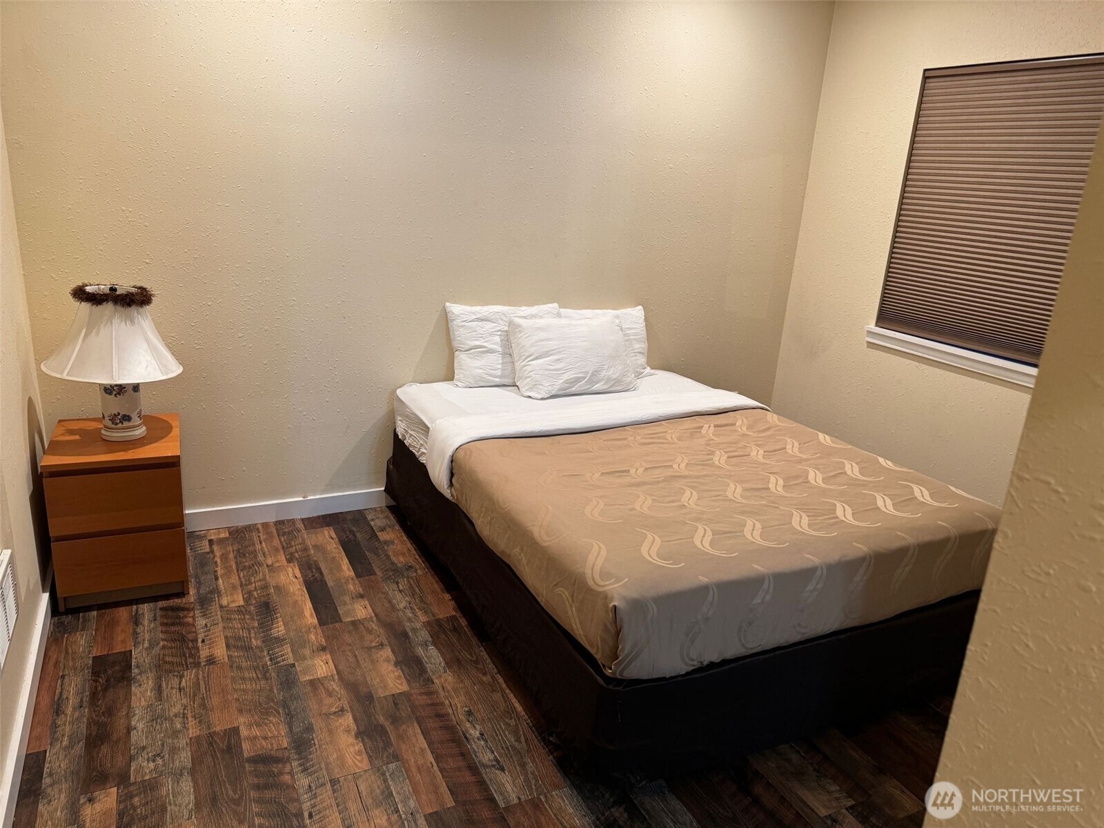 918 Orchard Avenue Gold Bar, WA 98251 - Photo 4 of 9 a bed sitting in a bedroom next to a window