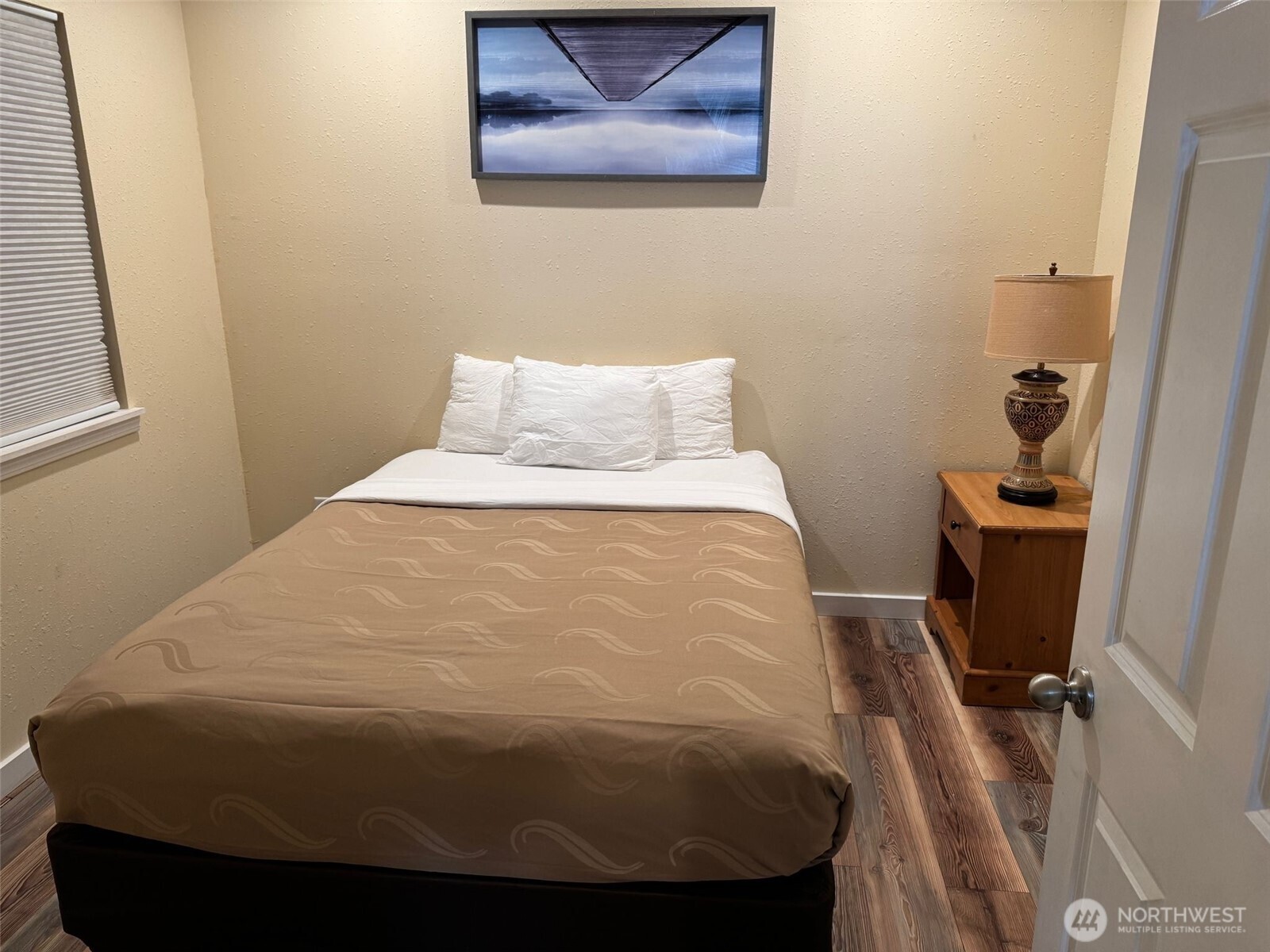 918 Orchard Avenue Gold Bar, WA 98251 - Photo 5 of 9 a bed sitting in a bedroom next to a window