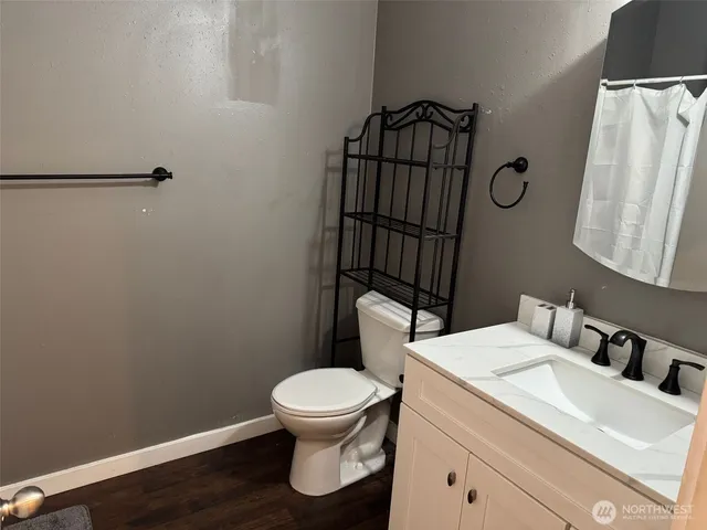 a white toilet sitting next to a bathroom sink