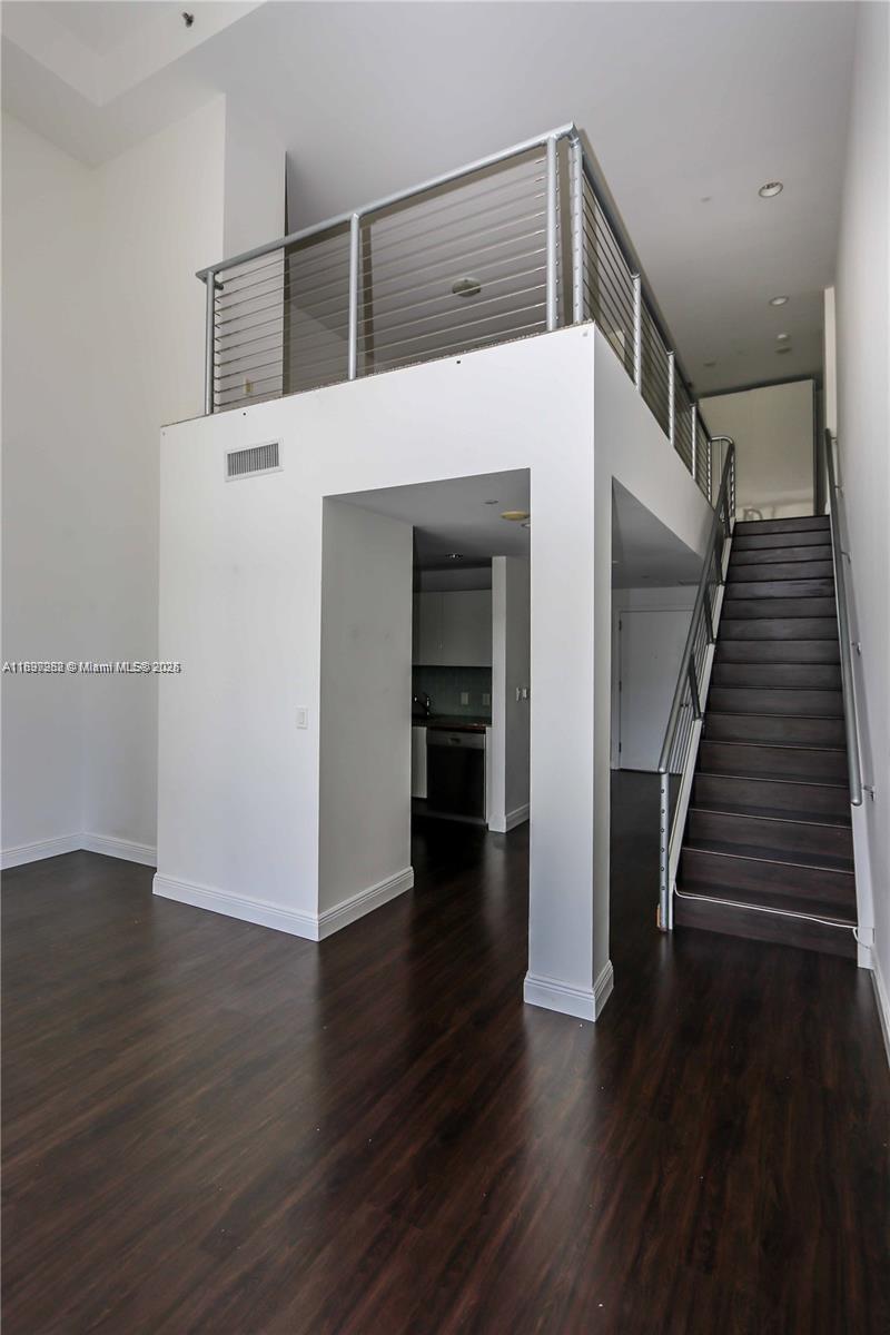 1050 Brickell Avenue, Unit 414 Miami, FL 33131 - Photo 19 of 42 a view of entryway with wooden floor