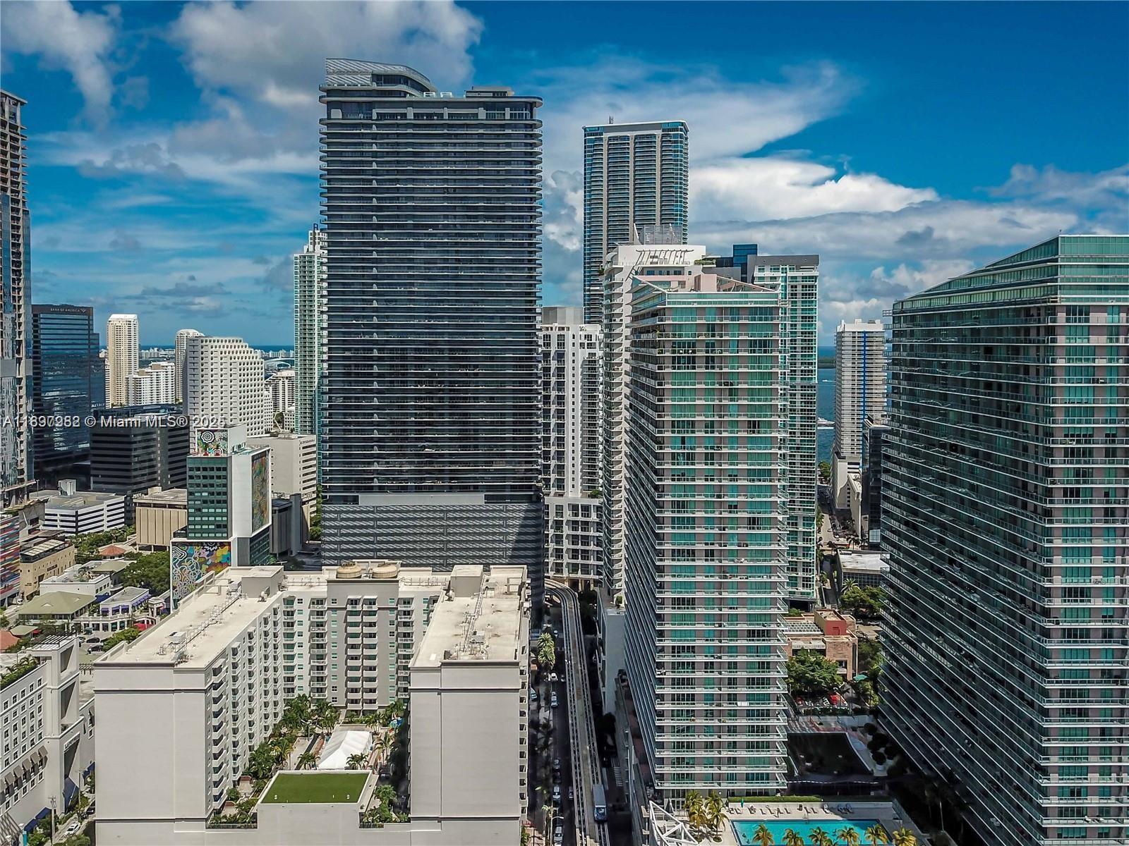 1050 Brickell Avenue, Unit 414 Miami, FL 33131 - Photo 35 of 42 a view of a balcony with a couple of cars parked in front of it