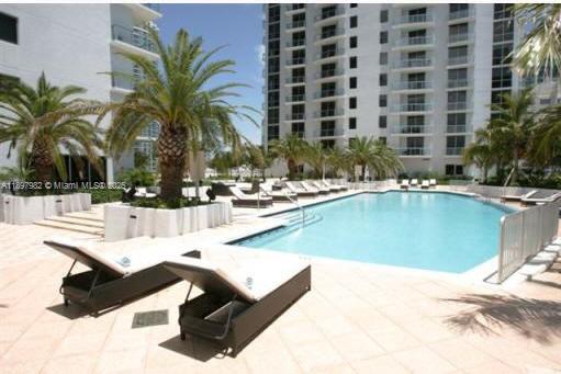 1050 Brickell Avenue, Unit 414 Miami, FL 33131 - Photo 36 of 42 a view of swimming pool with outdoor seating