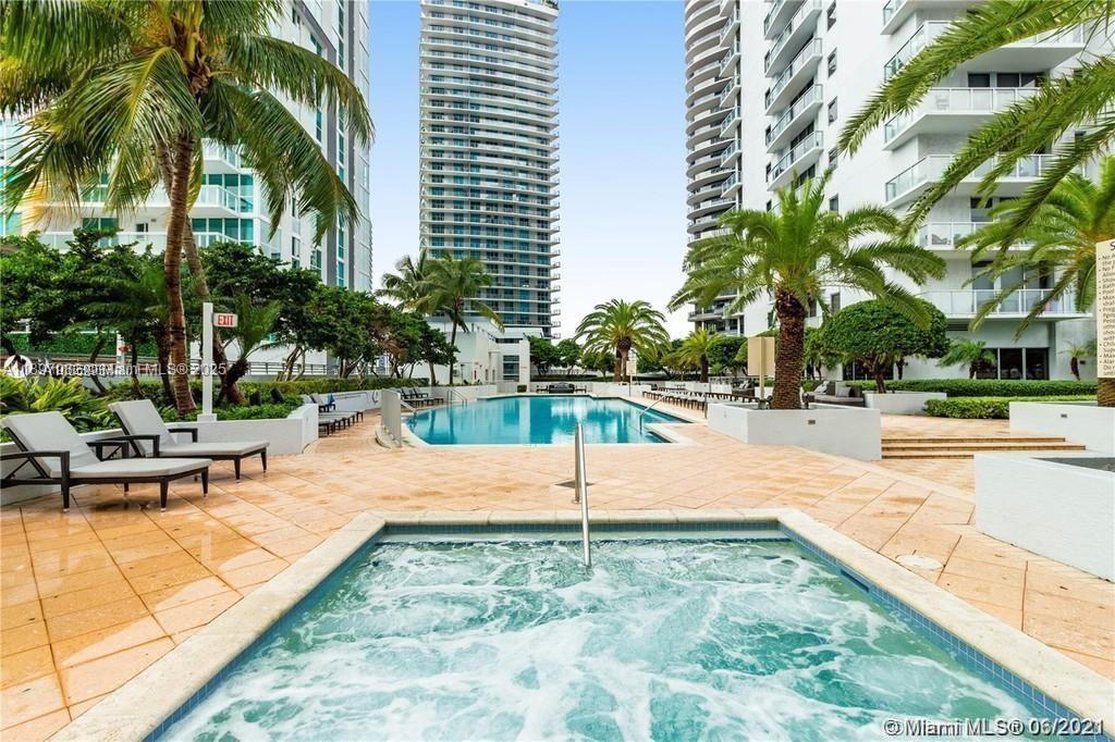 1050 Brickell Avenue, Unit 414 Miami, FL 33131 - Photo 37 of 42 a view of a swimming pool with a patio