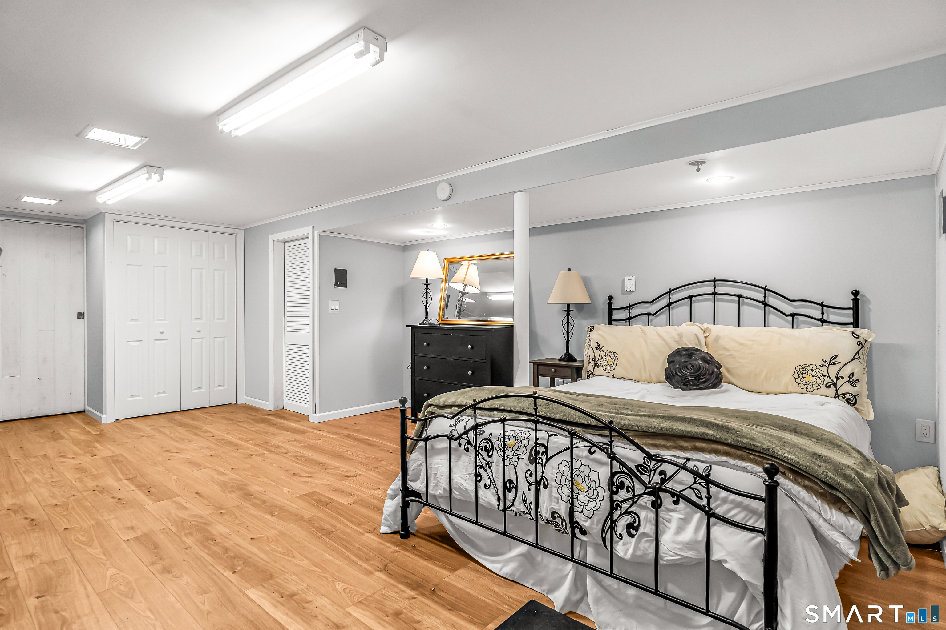 13 Pleasant Rise Circle Brookfield, CT 06804 - Photo 39 of 40 a bedroom with a bed and a mirror