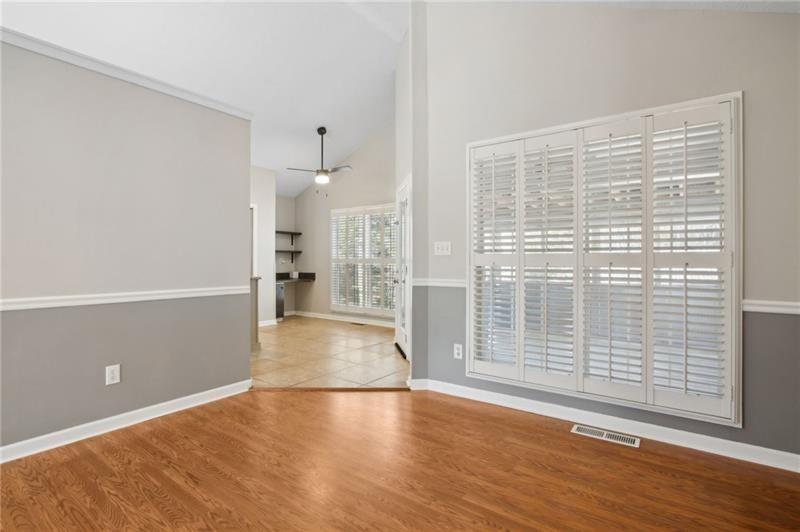 6604 Windbrook Way Flowery Branch, GA 30542 - Photo 16 of 64 a view of empty room with wooden floor and fan