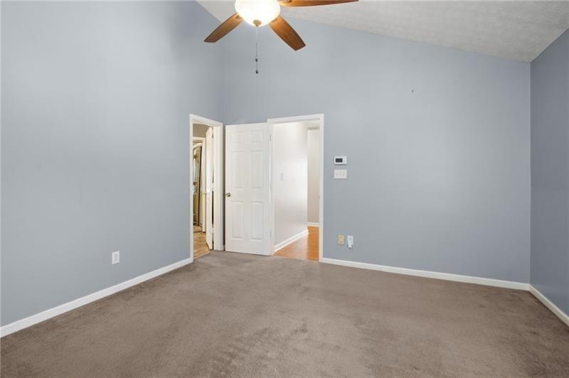 6604 Windbrook Way Flowery Branch, GA 30542 - Photo 30 of 64 an empty room with chandelier fan