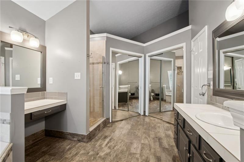 6604 Windbrook Way Flowery Branch, GA 30542 - Photo 34 of 64 a bathroom with a sink and a mirror