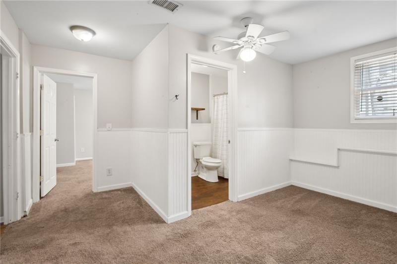 6604 Windbrook Way Flowery Branch, GA 30542 - Photo 44 of 64 wooden floor in an empty room with a window
