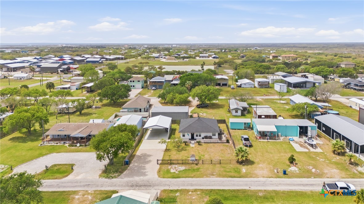 77 Carrie Street Port O'Connor, TX 77982 - Photo 3 of 32 an aerial view of residential houses with outdoor space