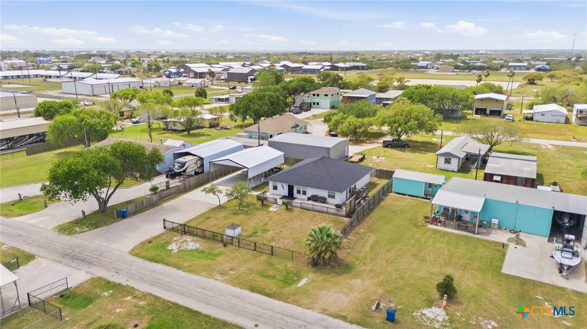 77 Carrie Street Port O'Connor, TX 77982 - Photo 5 of 32 an aerial view of residential houses with outdoor space