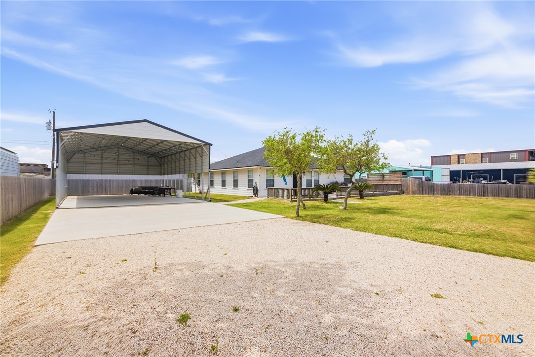 77 Carrie Street Port O'Connor, TX 77982 - Photo 7 of 32 a view of swimming pool with outdoor seating and yard in back