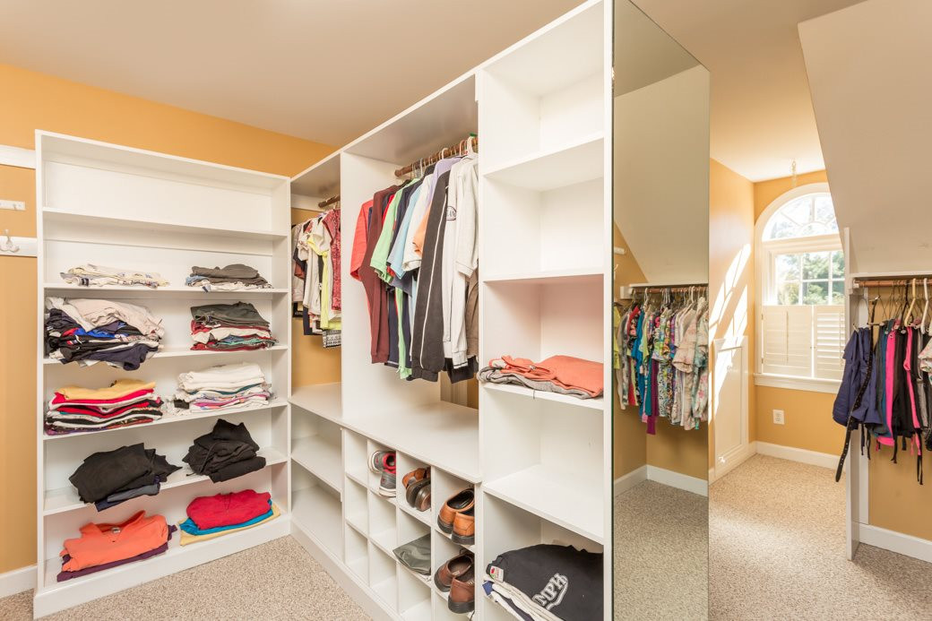 5215 Coffee Tree Drive Raleigh, NC 27613 - Photo 10 of 25 Incredible walk-in closet you’ve got to see to believe! Shelving, cubbies, hanging bars and lots of lighting are a fashionistas dream! A secret reading nook is accessed through the master walk-in closet! Master Walk-In Closet