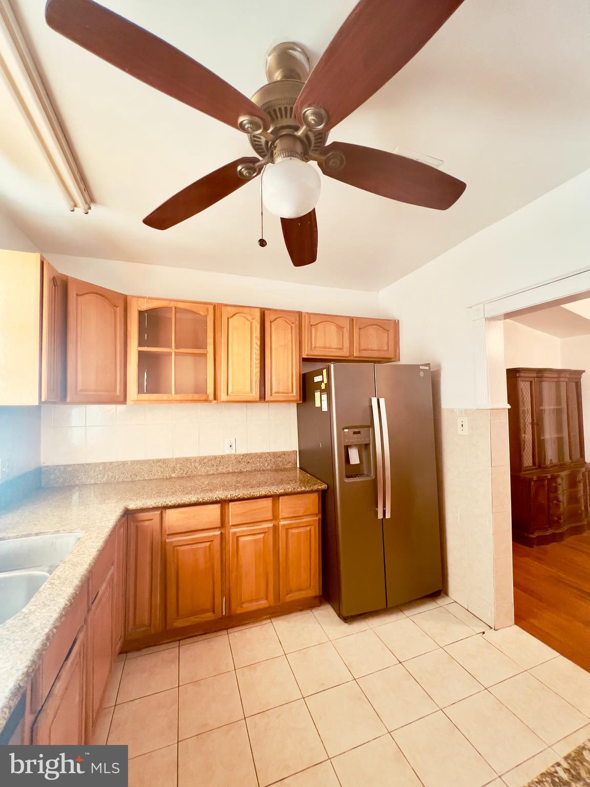 124 West Spencer Street Philadelphia, PA 19120 - Photo 12 of 34 a kitchen with stainless steel appliances granite countertop a refrigerator a sink and dishwasher