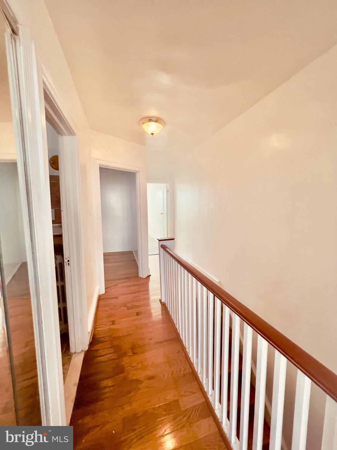 124 West Spencer Street Philadelphia, PA 19120 - Photo 16 of 34 a view of a hallway with wooden floor