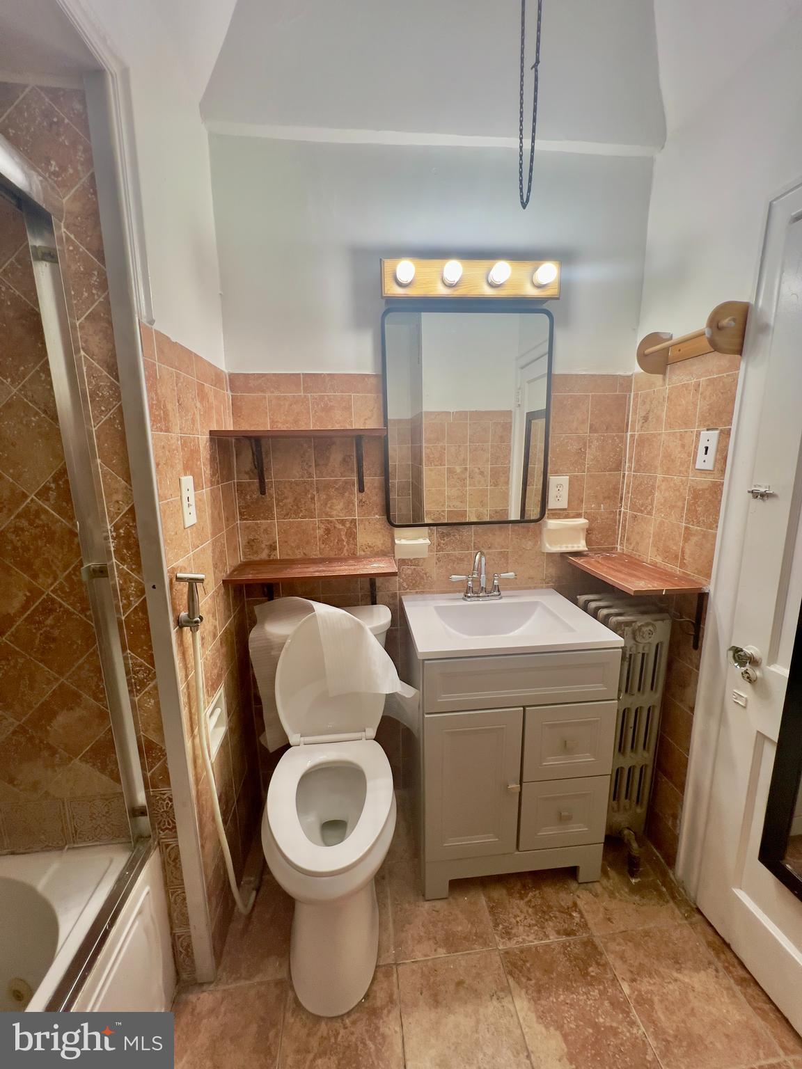 124 West Spencer Street Philadelphia, PA 19120 - Photo 21 of 34 a bathroom with a sink toilet and shower