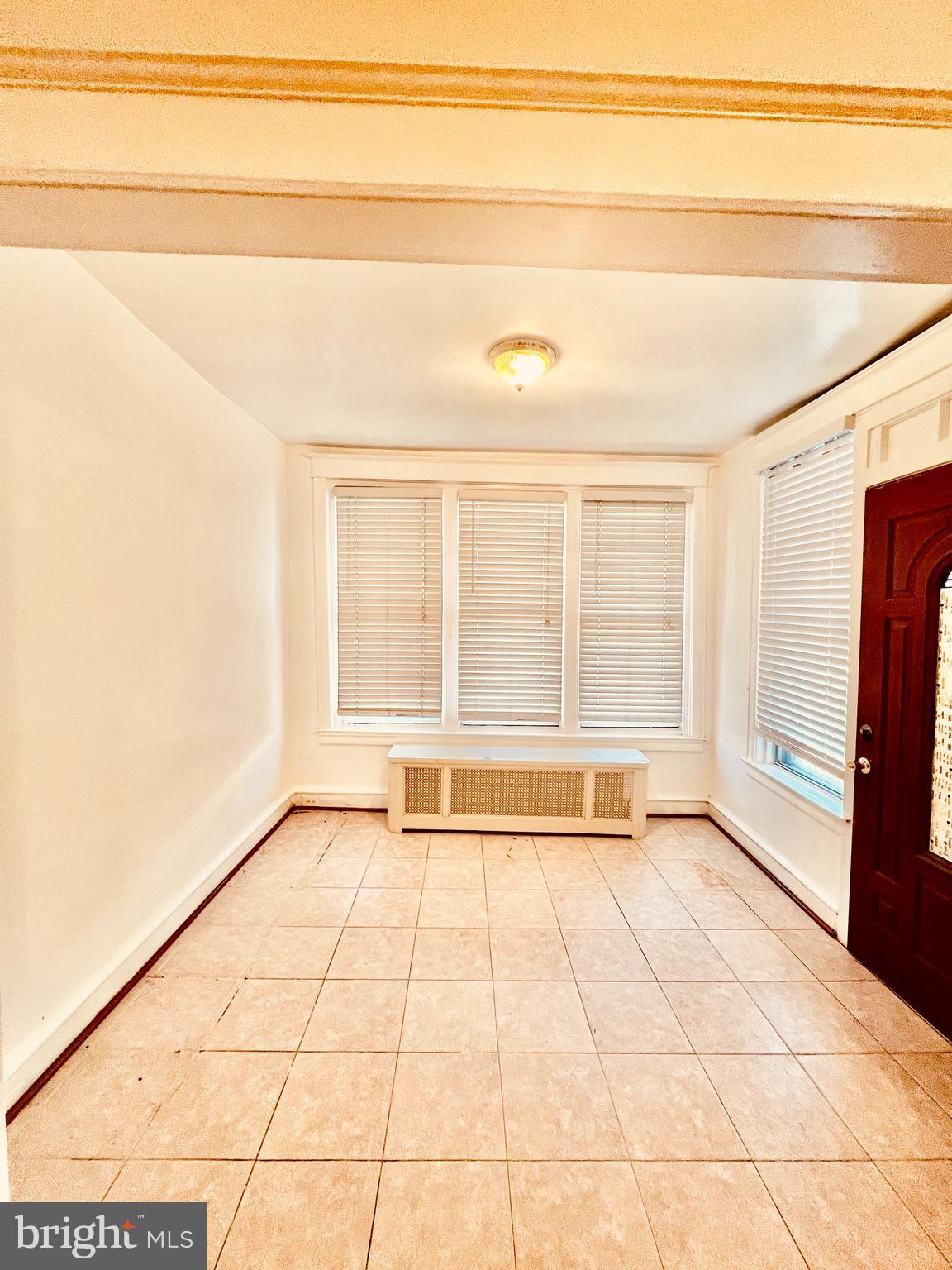 124 West Spencer Street Philadelphia, PA 19120 - Photo 3 of 34 a view of an empty room with a window