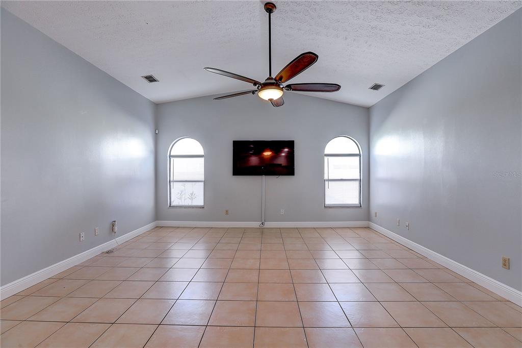 1418 Buckner Road Valrico, FL 33596 - Photo 22 of 37 a view of an empty room with a window