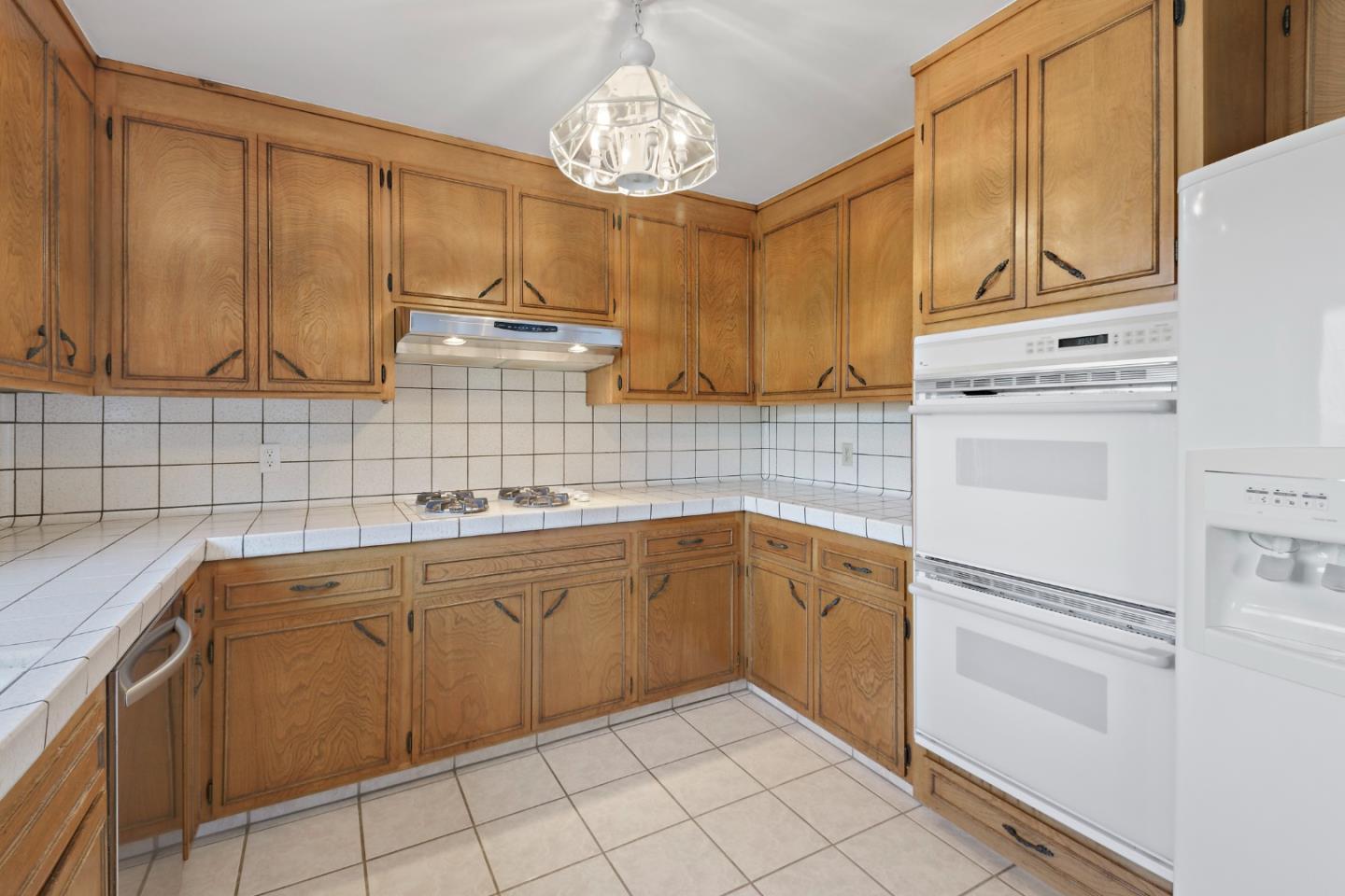 750 Clearfield Drive Millbrae, CA 94030 - Photo 14 of 35 a kitchen with cabinets a sink and appliances