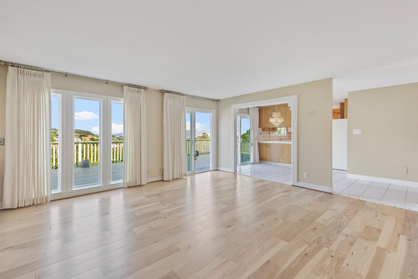 750 Clearfield Drive Millbrae, CA 94030 - Photo 20 of 35 a view of an empty room with a window and wooden floor