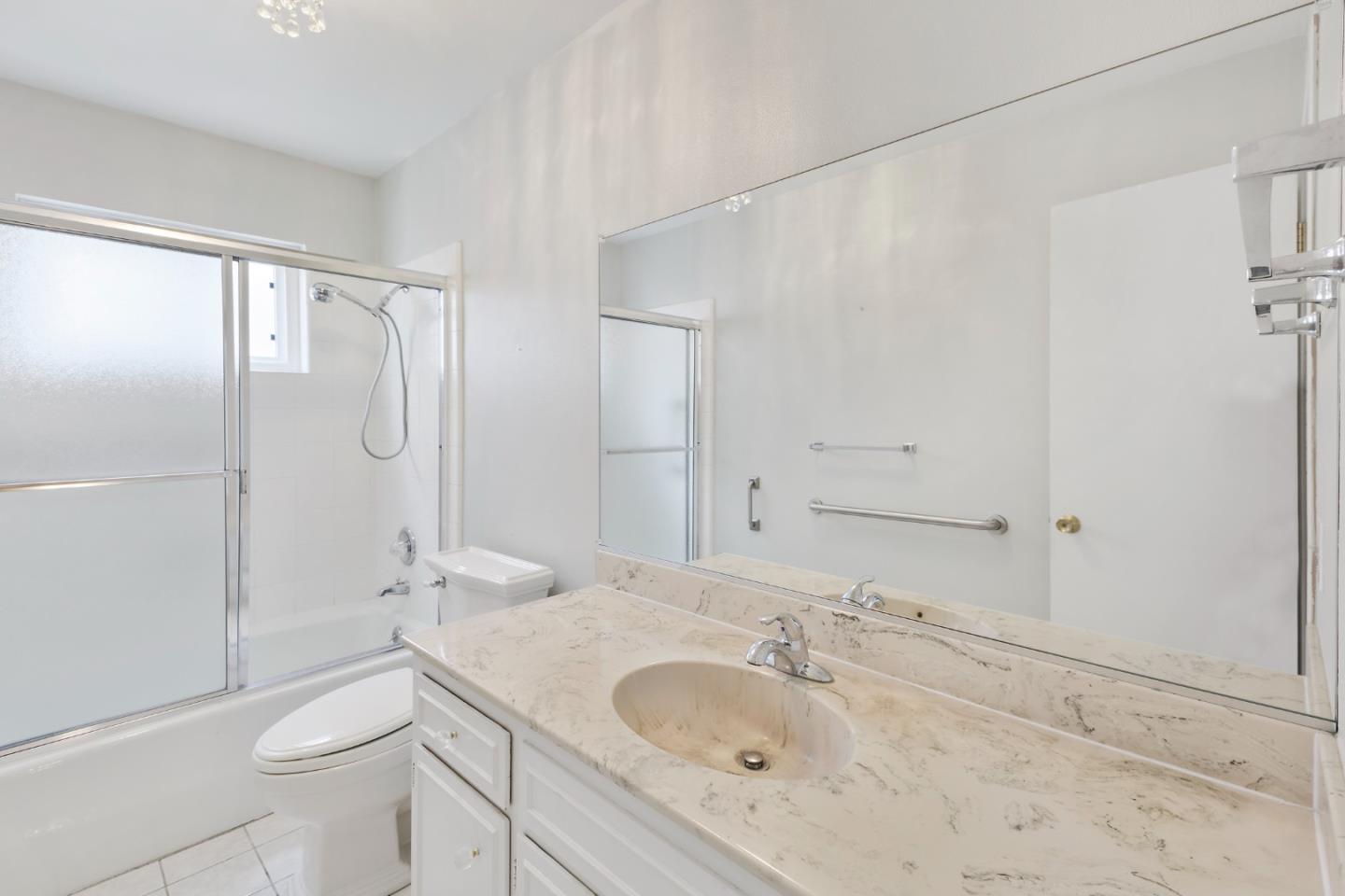 750 Clearfield Drive Millbrae, CA 94030 - Photo 27 of 35 a bathroom with a granite countertop sink a toilet and shower